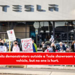 A guy hits demonstrators outside a Tesla showroom with his vehicle, but no one is hurt.